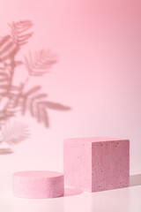Empty podium or stand for product showcase, plant and shadow on pink background
