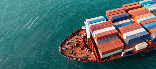 Aerial side view of cargo ship carrying container and running for export  goods  from  cargo yard...