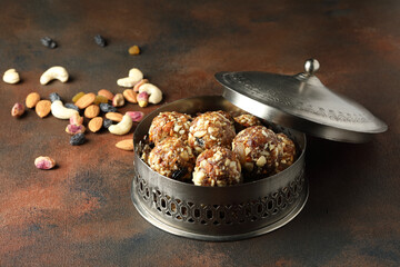 Indian sweet dry fruits and nuts laddu, which is a traditional, healthy, nutritious and popular...