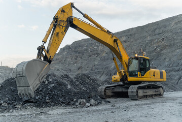 An excavator works at a gold mining site.