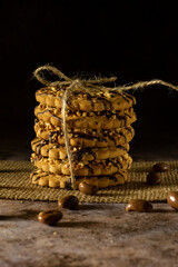 Cookies with peanuts. Cookies close-up.Cookies are arranged in a stack and tied up with a rustic string