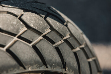 Close up of motorcycle tyre surface after ride.