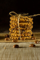 Cookies with peanuts. Cookies close-up.Cookies are arranged in a stack and tied up with a rustic string