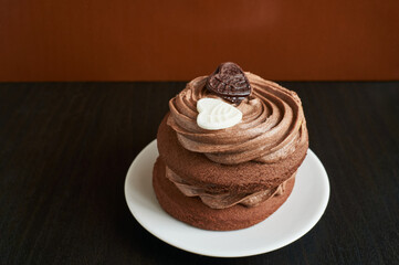 Chocolate cupcake on black and brown background