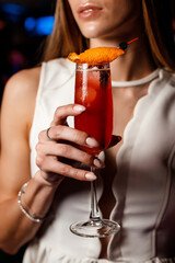 person drinking cocktail