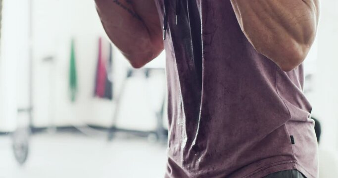 Youre only getting stronger. Closeup of fit and active man doing a workout using dumbbells at a gym. Unrecognizable bodybuilder at a health club lifting weights. Health, wellness and sport