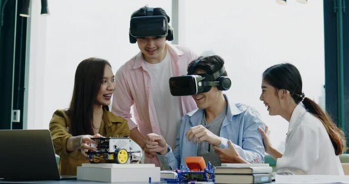 Group of Asian businessmen hold meeting to test VR glasses technology in co-working space. Collaboration of startup business team. learning innovation of meta verse technology of model electric car