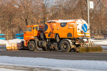 Snowplows removing the snow the highway on a cold snowy winter day.