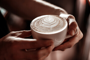 person holding a cup of coffee