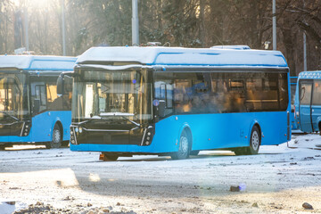 City bus at the terminus in a snowy winter environment.