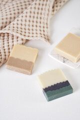 Organic handmade soap with natural ingredients and natural muslin towel. Spa at your home. Front view.