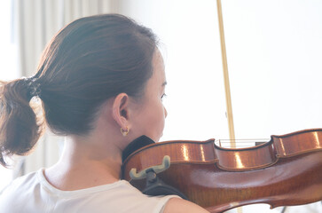 woman play violin in music like musician or violinist show string in portrait with sun