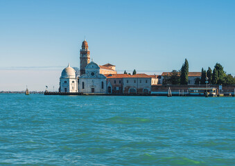 Fototapeta premium San Michele in Isola is a Roman Catholic church, located on the Isola di San Michele, a small islet sited between Venice and Murano, View from the water (facade facing East)