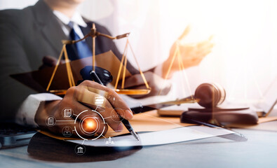 Judge gavel with Justice lawyers having team meeting at law firm in background. Concepts of law.