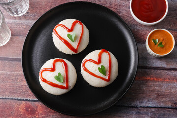 valentines day special idli idly with love red heart South Indian breakfast Valentine's Day red and green hearts on Indian food. V-day. Idli Hearts food art