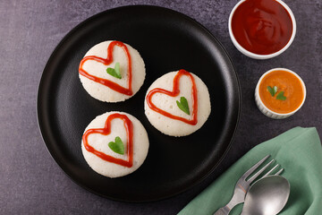 valentines day special idli idly with love red heart South Indian breakfast Valentine's Day red and green hearts on Indian food. V-day. Idli Hearts food art