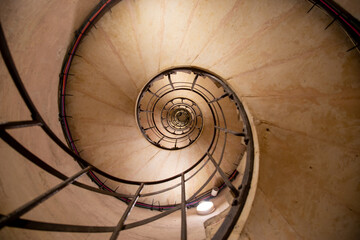 Spiral stairs view, suitable for backgrounds.