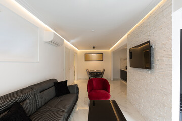Living room interior with wall mounted tv and marble floor