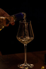 wine glasses and bottles of wine in the entourage of the wine bar in the evening
