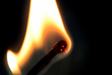 Phosphorus burns in orange flame with dark background