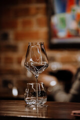 wine glasses and bottles of wine in the entourage of the wine bar in the evening