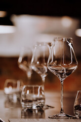 wine glasses and bottles of wine in the entourage of the wine bar in the evening