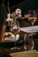 wine glasses and bottles of wine in the entourage of the wine bar in the evening