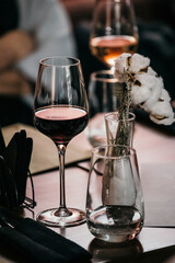 wine glasses and bottles of wine in the entourage of the wine bar in the evening