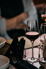 wine glasses and bottles of wine in the entourage of the wine bar in the evening