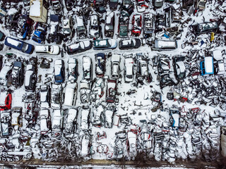 Junkyard aerial. Car dump in winter. broken abandoned cars.