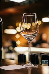 wine glasses and bottles of wine in the entourage of the wine bar in the evening