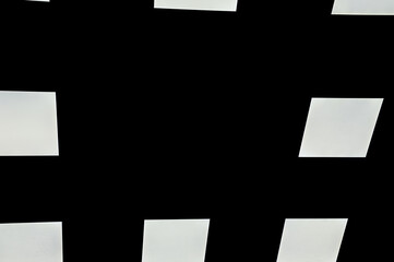 White squares on a black background. White square led light on a black background. Beautiful background