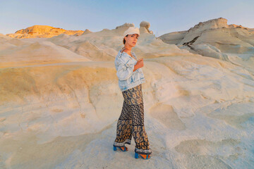 woman on the beach with a hat in milos greece model shooting 