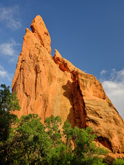 Fototapeta premium Red and orange sandstone cliffs in late afternoon light in Garden of the Gods Colorado Springs