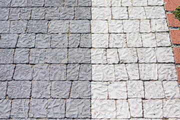 The pavement of granite cobblestones. Old city road