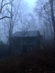 Spooky House in the foggy woods