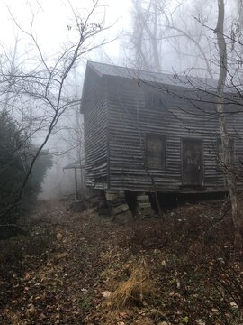 Spooky House in the foggy woods