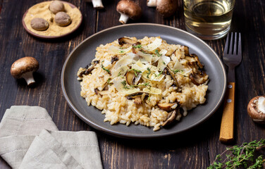 Risotto with mushrooms, cheese and thyme. Vegetarian food. Italian food.