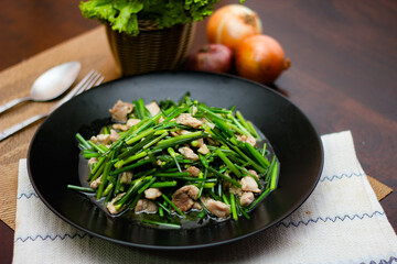 Stir-fried morning glory in a black dish "Stir-Fried Morning Glory" is also one of the most delicious dishes you can eat in Thailand.