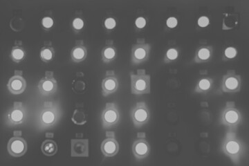 Blurry unsharp abstract shiny background of glowing light bulbs and lamps in the store