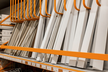 Obraz premium Cable channel box for wiring protection packed in a hardware store on a shelf. Objects and materials for repair
