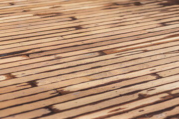 Background and texture of decorative old wood striped on the floor surface. pattern from a wooden bar