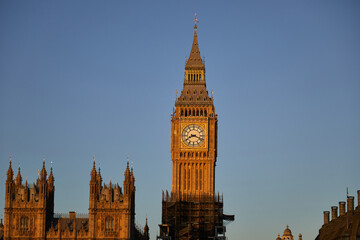Fototapeta na wymiar Big Ben at dawn from the south bank of the river Thames, golden hour