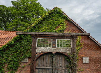 old vintage wooden door aganst brick house
