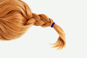 Redhead a blond wig hair braided braid. White background.