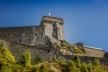 Castle on the hill. Architecture of old Europe. An impregnable fortress on a hill. Bottom view of...