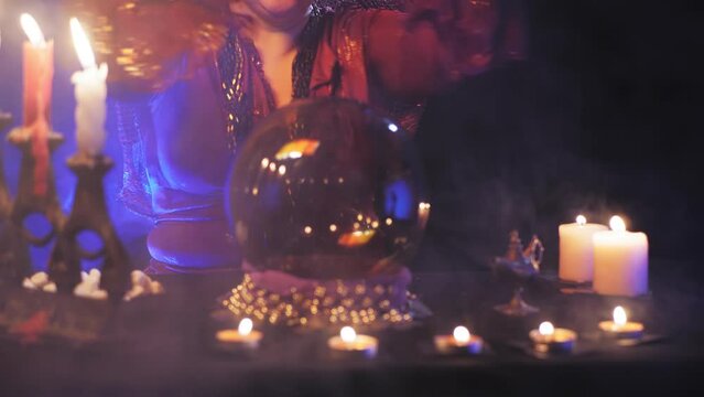 fortune teller without a face read the future in a crystal ball and white stones. Overall plan