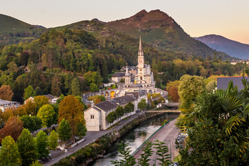 Fototapeta premium Pilgrimage Center. Sanctuary in Lourdes. Shrine in France. Way of St. James. Notre Dame de Lourdes. Catholic Basilica. Stone church. Saint Bernadette. Nun Bernadette Soubirous.