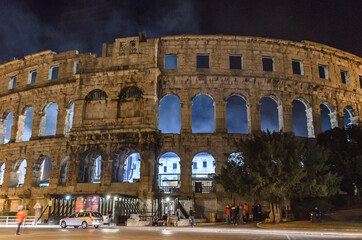 The Pula Arena is Hosting a Live Concert in Croatia. Ancient Roman Amphitheatre. Smoke and Light...