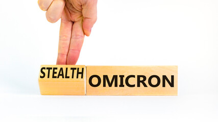 Covid-19 stealth omicron symbol. Doctor turns a cube and changes the word omicron to stealth omicron. Beautiful white background. Medical, covid-19 corona stealth omicron concept. Copy space.